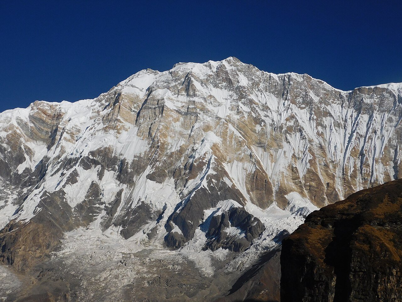 A close landscape view of the snowy south face of Annapurna I