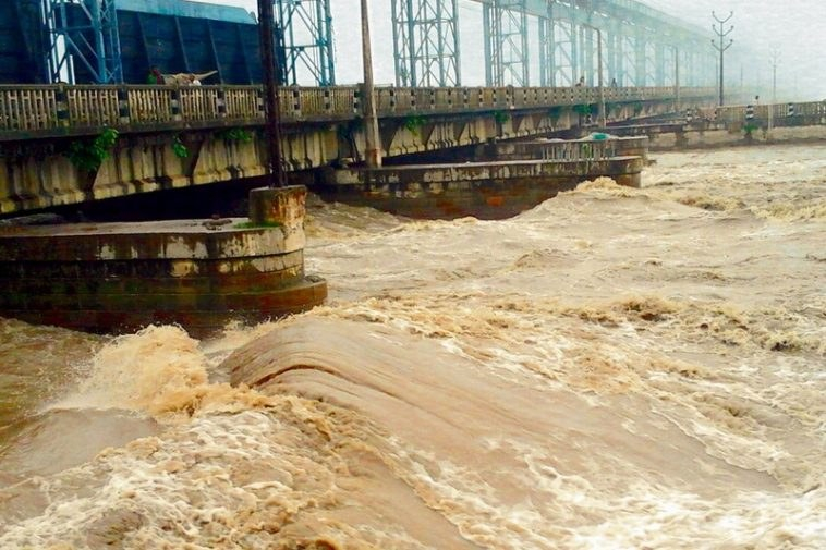 Elevated water flowing through opened gates of the Koshi Barrage on the Saptakoshi River in Nepal.